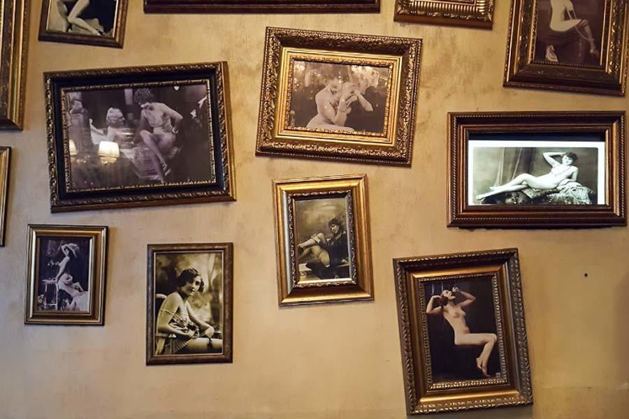 Nude photographs from the 1920s on the wall at Bordello Bar 